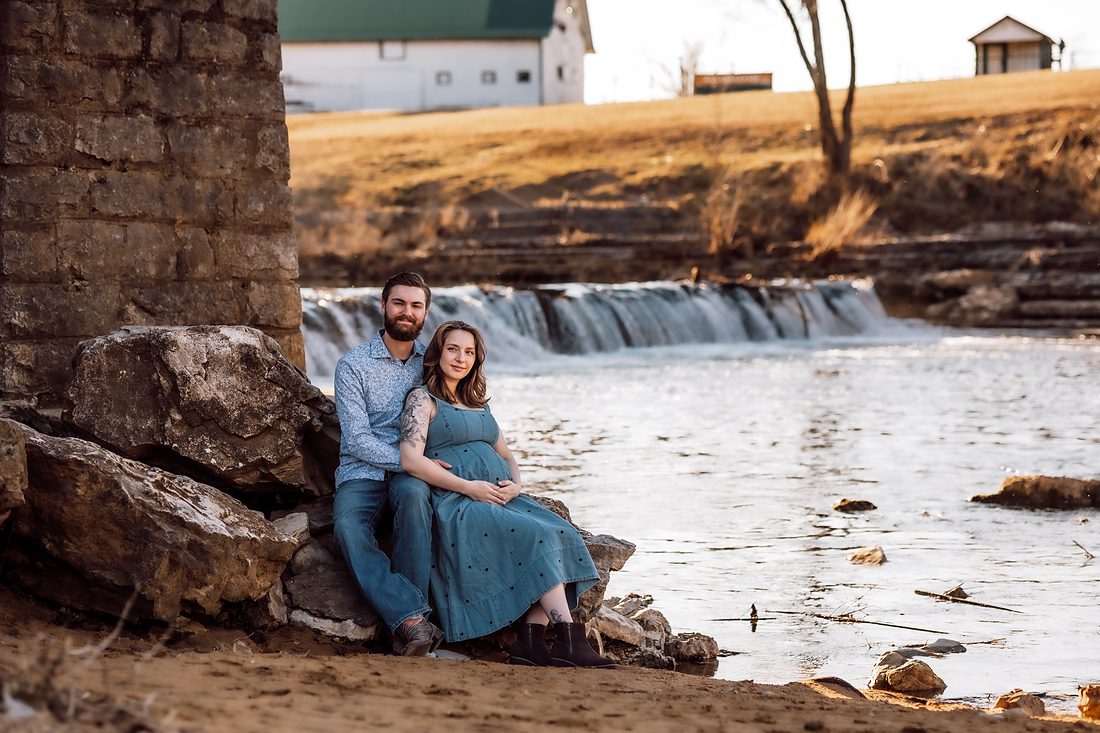 The family behind Iron Bond Fabrication, photographed beside a low waterfall in Northwest Arkansas