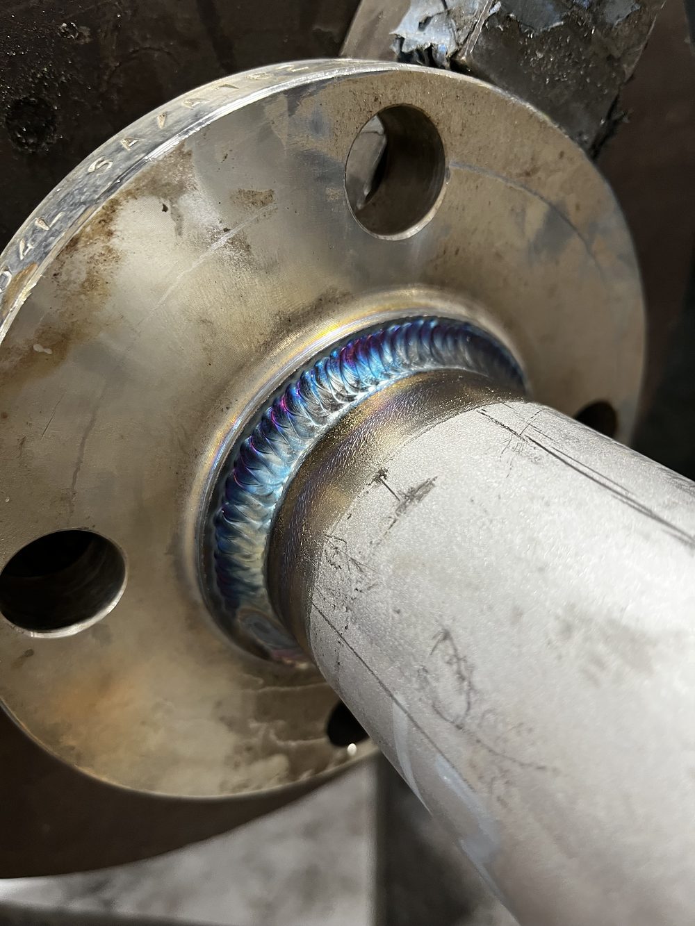 Angled branch welded into a stainless flange