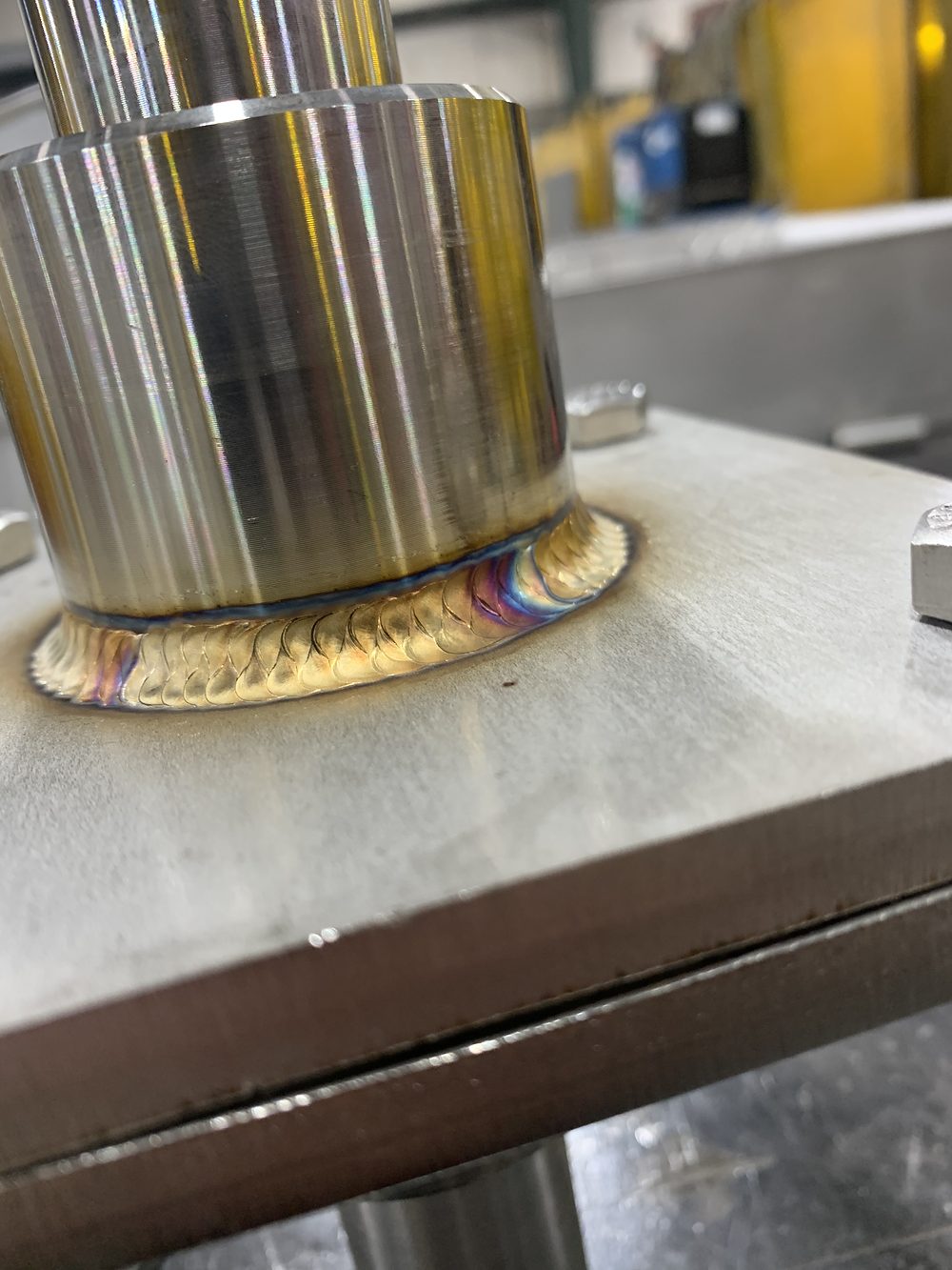 Stainless boss welded to plate
