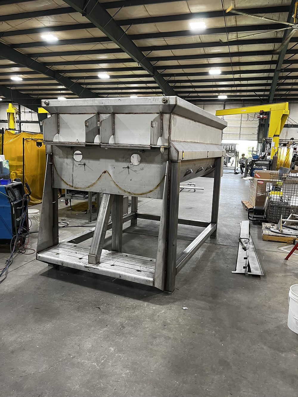 Stainless hopper on a fabricated frame
